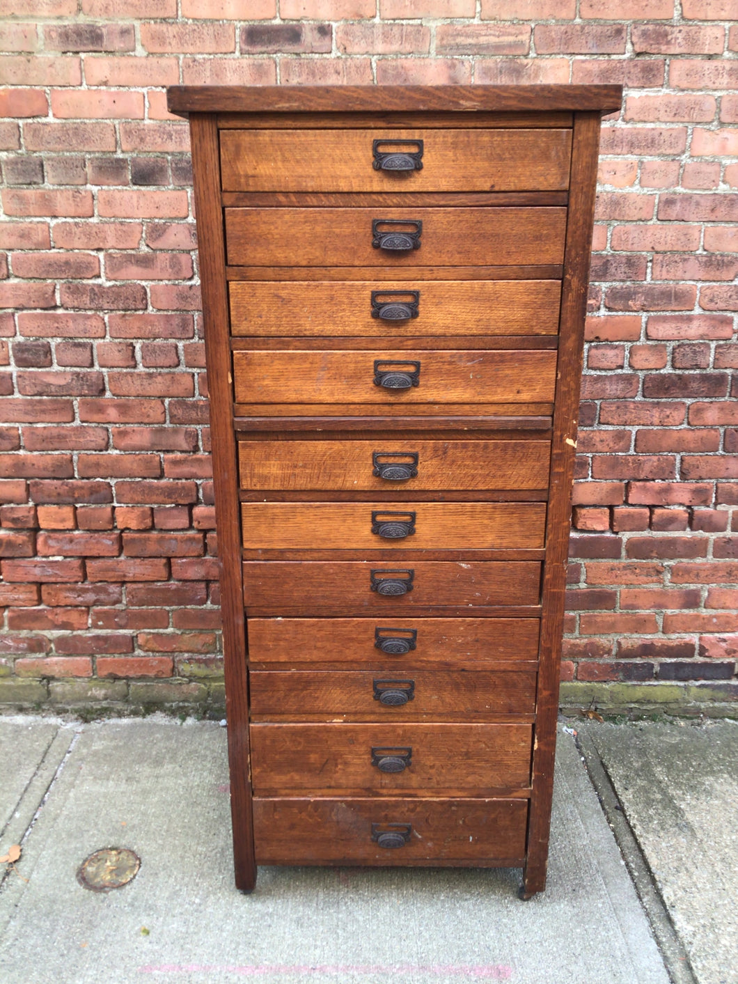 Antique cabinet with 11 drawers and pull-out shelf